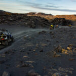Some buggies and ATVs drive through Icelandic nature